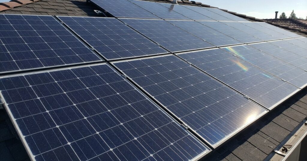Close-up of monocrystalline solar panels on residential roof