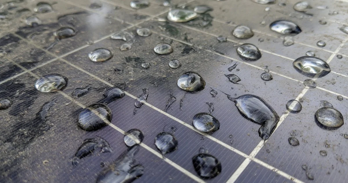 Close-up of soiled solar glass after dust and rain